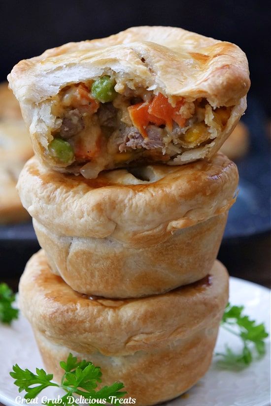 there are three pies stacked on top of each other with meat and veggies in the middle