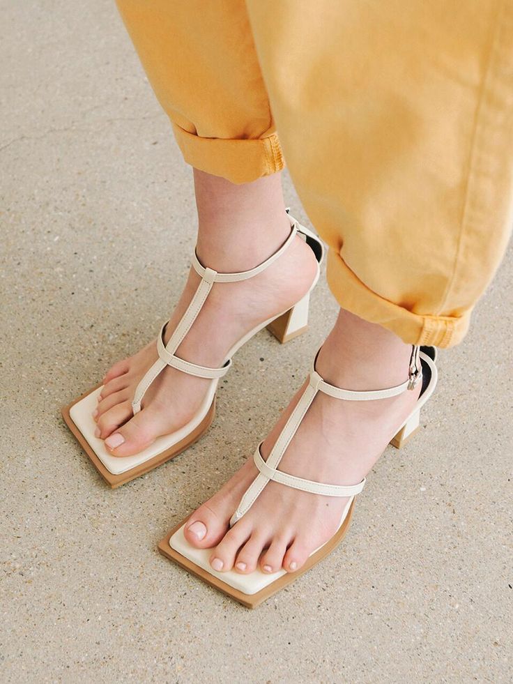 Editor's NotesThe edge sandals features angled square toe that create chic and edge looks- Angled sqaure toe sandals- Kitten heels- Adjustable ankle strap- Thong stringMeasuremets(in.)- Size: KR220(US5) - KR255(US8.5)- Heel height: 2.4in.- Fits true to the sizeComposition & Care- Sheepskin- Do not washDesigner- Made in Korea- by NONETHELESS Chic T-strap Sandals With Sculpted Heel And Ankle Strap, Summer T-strap Sandals With Branded Heel Counter, Summer Square Toe Heels With Heel Loop, Summer Heels With Heel Loop And Square Toe, Chic T-strap Sandals With Heel And Toe Post, Summer T-strap Sandals With Ankle Strap And Branded Heel, Chic T-strap Sandals With Heel Strap, Square Toe Heels Medium Width For Summer, Spring Square Toe Heels With Sculpted Heel