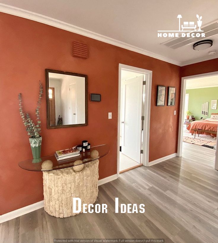 a living room with orange walls and wood flooring is featured in the home decor magazine