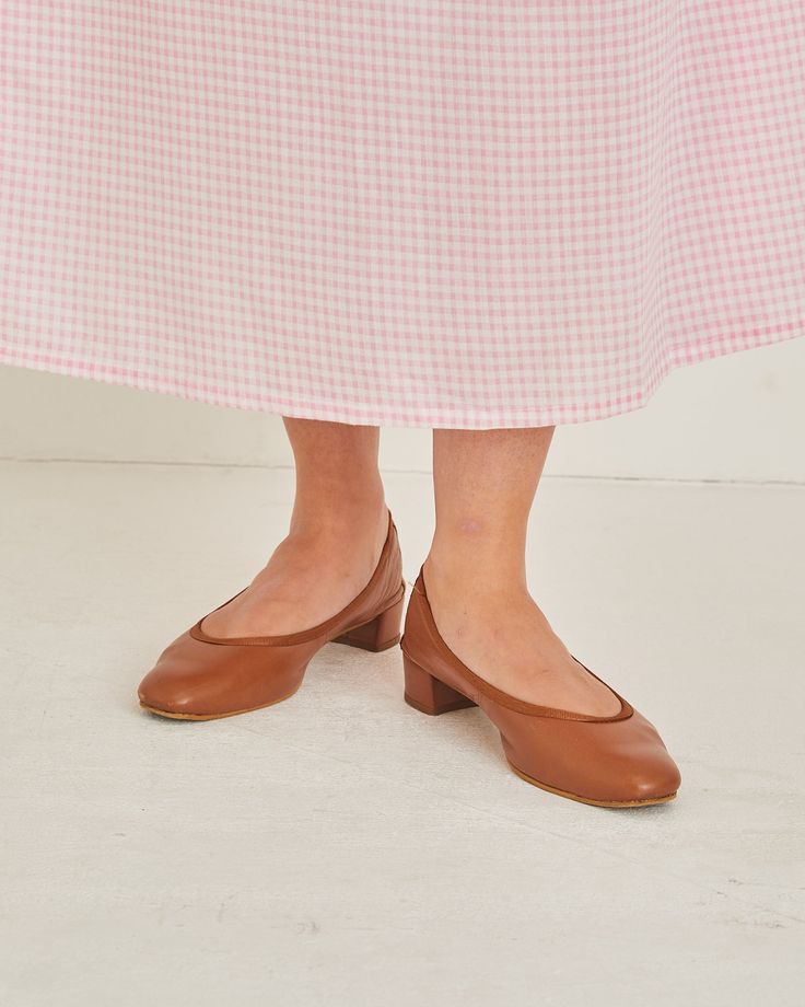 Step out in style with these vintage tan ballet pumps! Crafted from supple leather, these pumps are designed with comfort and chic style in mind- perfect for any occasion. Slip on a pair for a look that is classic and timeless. UK size 7 Spring Brown Block Heel Court Shoes, Spring Brown Court Shoes With Block Heel, Spring Brown Leather Court Shoes, Brown Court Shoes With Sculpted Flat Heel, Brown Almond Toe Court Shoes For Spring, Classic Low Heel Ballet Flats For Fall, Brown Closed Toe Court Shoes With Stacked Heel, Spring Ballet Flats With Sculpted Heel, Brown Court Shoes With Stacked Heel And Closed Toe