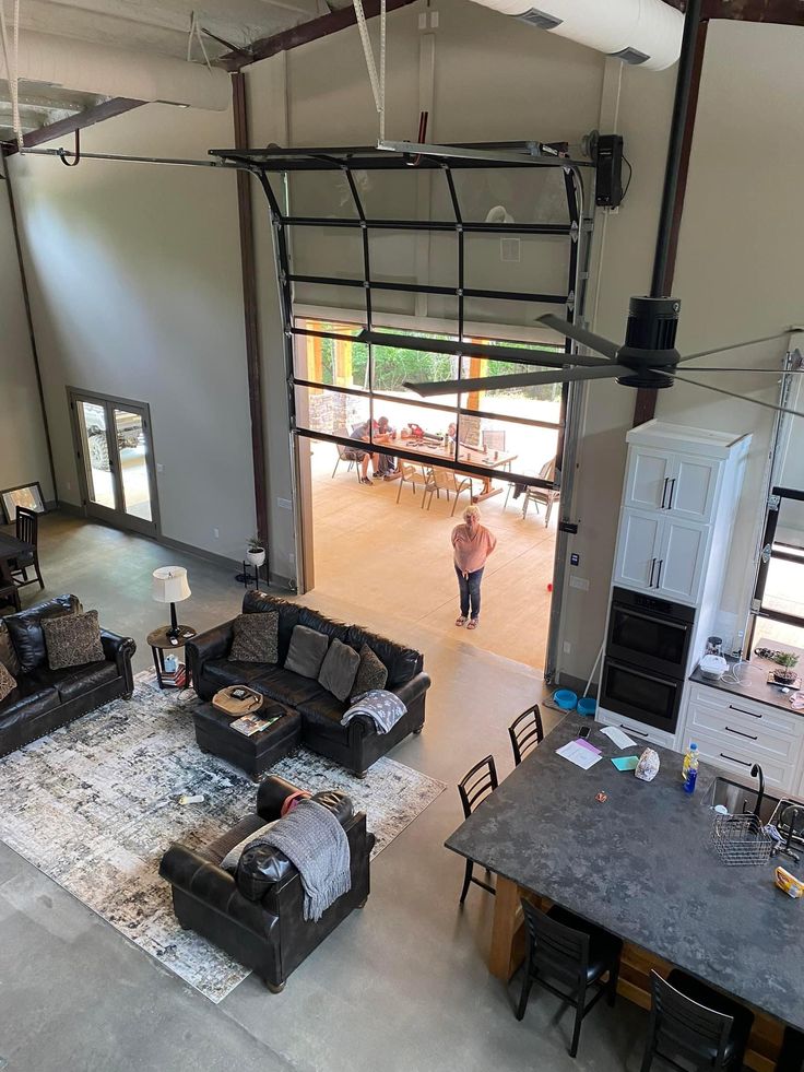 an overhead view of a living room and kitchen area in a house with lots of furniture