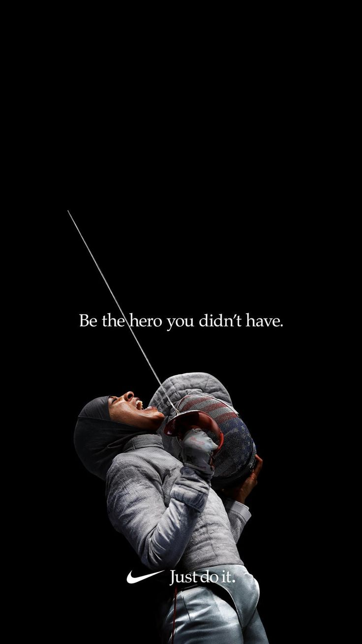 a man in grey jacket leaning against a black background with the words, be the hero you didn't have