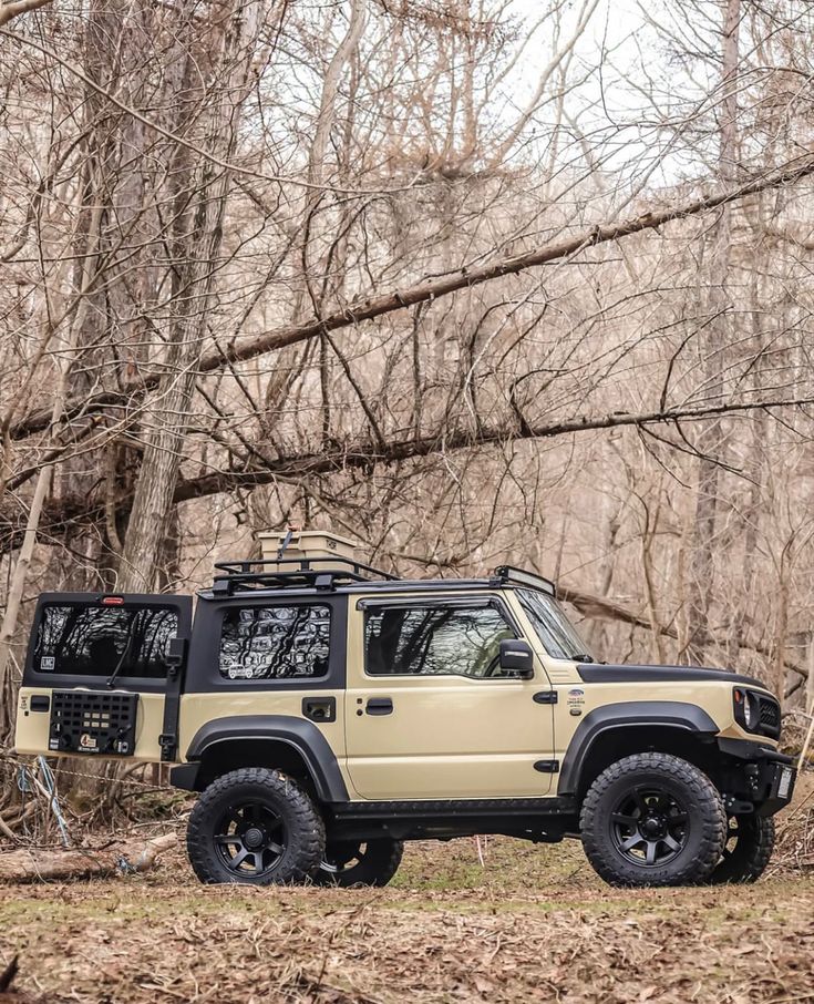 an off - road vehicle is parked in the woods