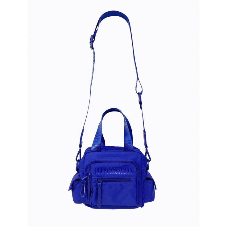 The Block Bag is lined in recycled rPET fabric with matching blue powder-coated hardware, carabiner and faux leather zip pullers. With a short nylon strap and an extra adjustable long nylon strap, this bag provides versatility and can be worn on the arm, or as a cross-body bag. This bag features an internal and external zip pocket, a front two section compartment, and two side compartments to provide added practicality. * rPET fabric is made from recycled post-consumer plastics otherwise destine Functional Blue Nylon Shoulder Bag, Trendy Nylon Satchel With Adjustable Strap, Nylon Crossbody Satchel With Adjustable Strap, Trendy Blue Shoulder Bag For Outdoor, Functional Nylon Satchel With Detachable Strap, Sporty Nylon Bag With Detachable Strap, Functional Nylon Shoulder Bag With Adjustable Handle, Blue Nylon Shoulder Bag For Outdoor, Blue Outdoor Shoulder Bag With Adjustable Strap