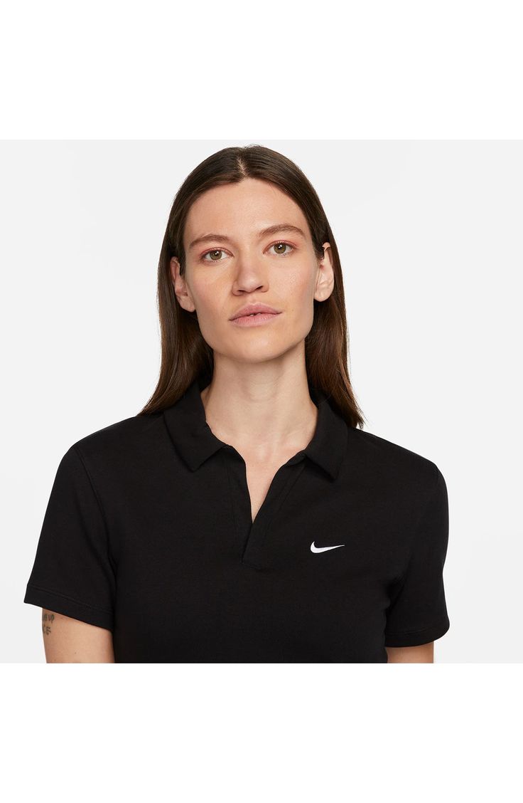 This trim stretch-jersey polo ups the stakes in the style game with a cropped profile and a button-free placket. 18" length (size Medium) Half placket Spread collar Short sleeves 97% cotton, 3% spandex Machine wash, tumble dry Imported Nike Classic Collared Tops, Classic Nike Collared Tops, Classic Collared Nike Tops, Nike Classic Fitted Tops, Classic Fitted Nike Tops, Nike Essentials, Stretch Cotton, Ups, Short Sleeves