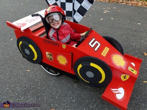 a child in a red race car costume