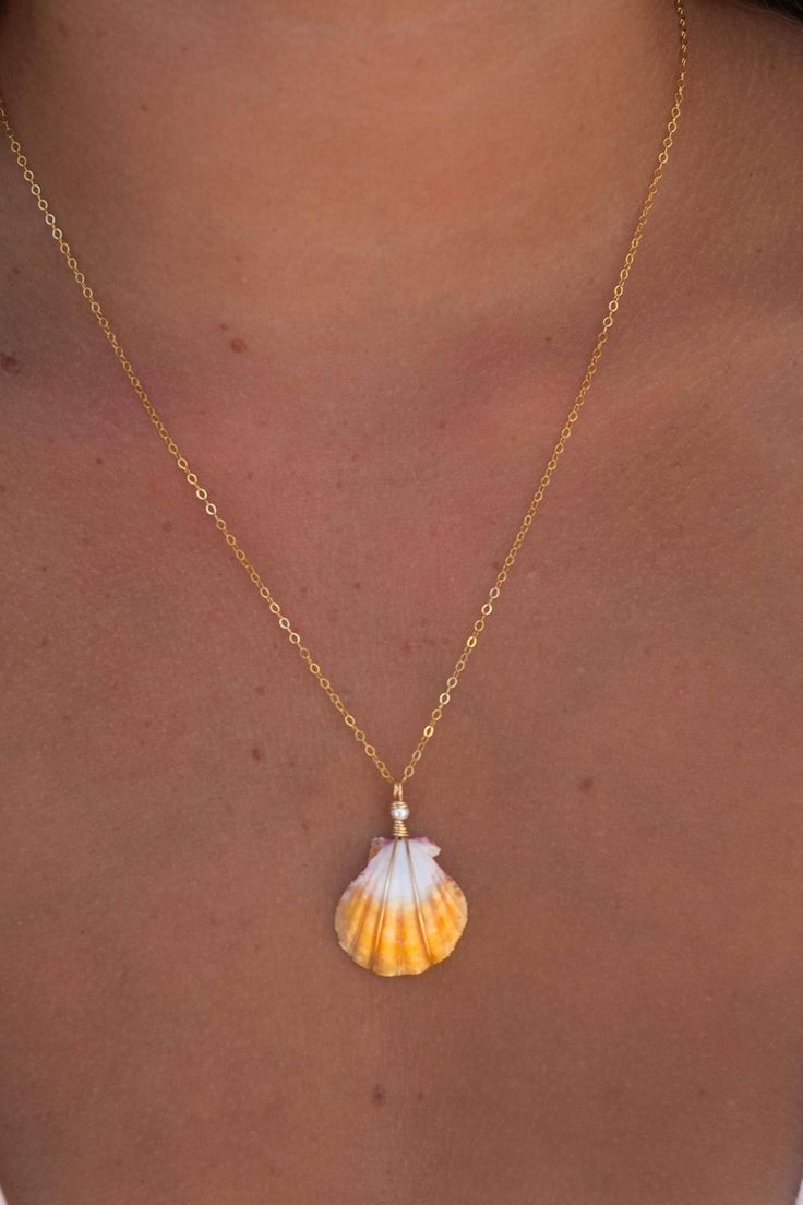 Yellow and white sunrise shell,wrapped in 14k gold filled wire. Accented with a freshwater pearl and hung on a 18" gold filled chain. Shell is nickel size, found on Oahu. Yellow Sunrise, Sunrise Shell, Shell Necklace, Shell Necklaces, Gold Filled Chain, Oahu, Fresh Water, Halloween Shopping, Freshwater Pearls