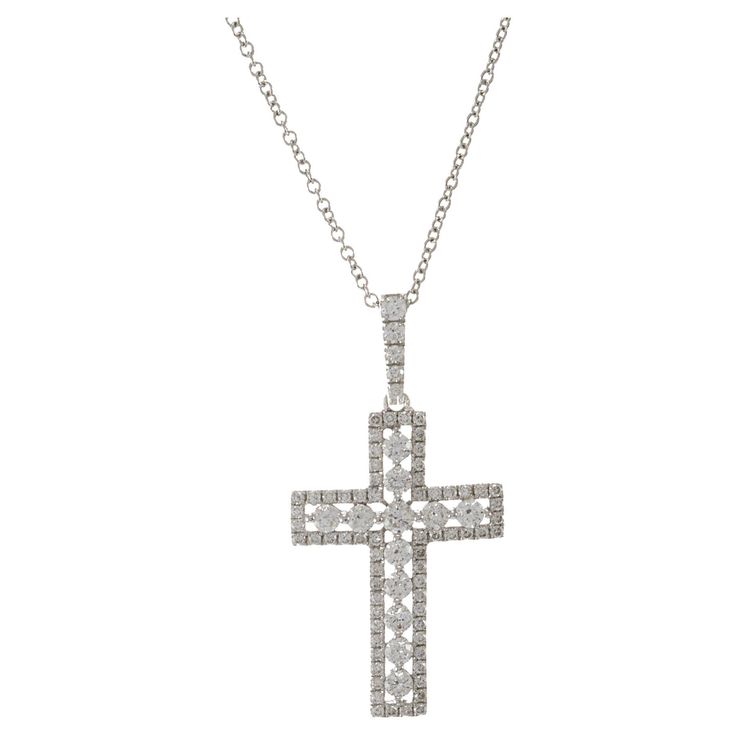 This gorgeous 18KT white gold cross diamond pendant is truly exquisite, featuring a total of 0.72CT-TW G color VS1-VS2 clarity round brilliant cut diamonds. The meticulous arrangement of these high-quality diamonds creates a stunning luster, making this pendant a luxurious and special piece of jewelry. Whether worn for its symbolic significance or simply to revel in its beauty, this cross pendant is a timeless accessory that adds a touch of elegance to any ensemble. Length 18 inches. Weight 3.5 grams. Hamsa Pendant, Diamond Cross Pendants, Modern Necklaces, Cross Jewelry, Timeless Accessories, Gold Cross, Round Brilliant Cut Diamond, Quality Diamonds, Pendant Set