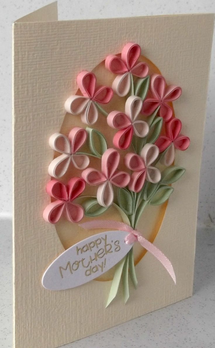 a card with pink flowers on it and a ribbon around the edge that says happy mother's day