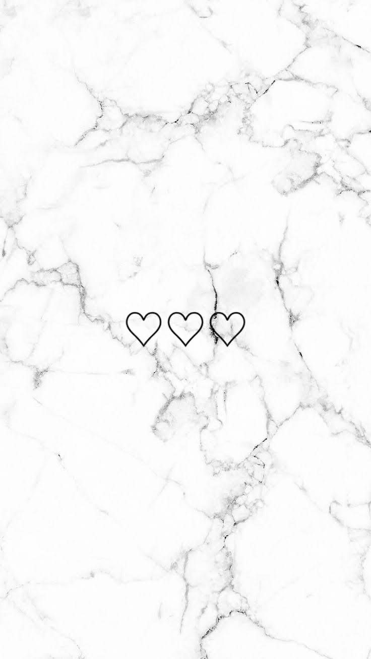 two hearts on a white marble background