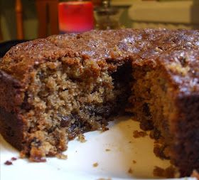 a chocolate cake is cut in half on a plate