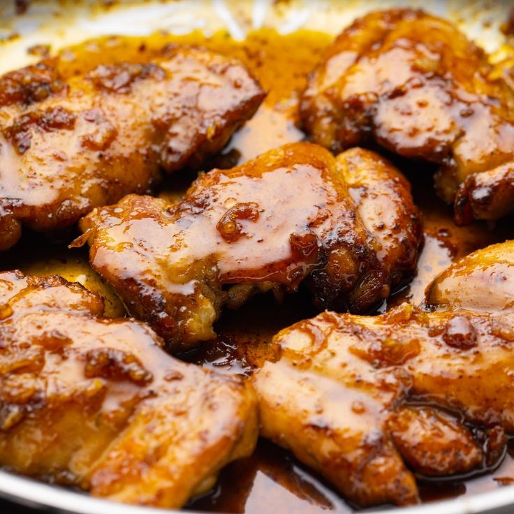 chicken wings with sauce in a pan on the stove