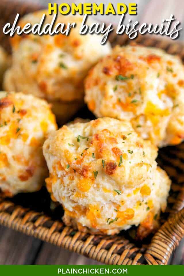 homemade cheddar bay biscuits in a wicker basket with text overlay that reads, homemade cheddar bay biscuits