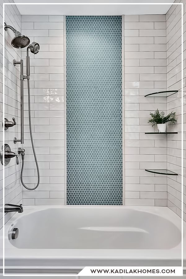 a white bath tub sitting inside of a bathroom next to a shower head and shelves