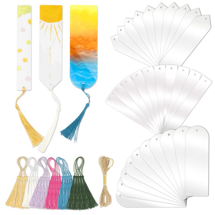 several different types of paper with tassels on them