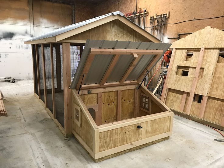 an outdoor storage shed made out of pallet wood