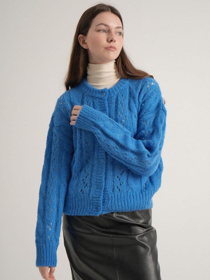 Composition : acrylic 55% + nylon 20% + wool 20% + alpaca 5%Color : Blue_freeCountry of Origin : Republic of Korea Blue Wool Cardigan For Fall, Blue Wool Cardigan For Layering, Blue Cable Knit Outerwear For Fall, Cozy Blue Acrylic Sweater, Blue Cable Knit Outerwear, Trendy Blue Chunky Knit Cardigan, Casual Mohair Outerwear For Layering, Blue Acrylic Sweater For Fall, Blue Winter Pointelle Knit Cardigan