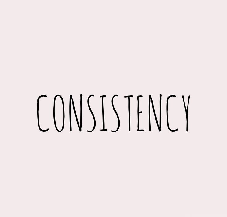 the word constistency written in black ink on a white background