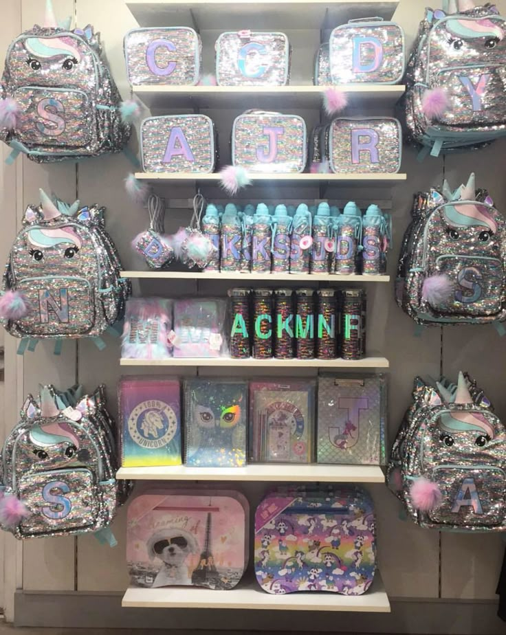 the shelves are filled with backpacks and other items