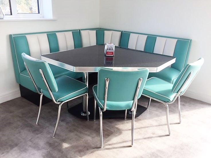 a round table with blue chairs around it