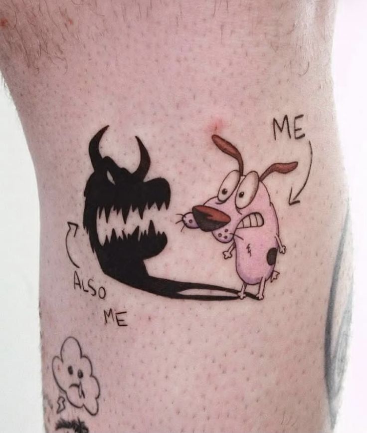 a man with a tattoo on his leg that has an image of a dog and a demon