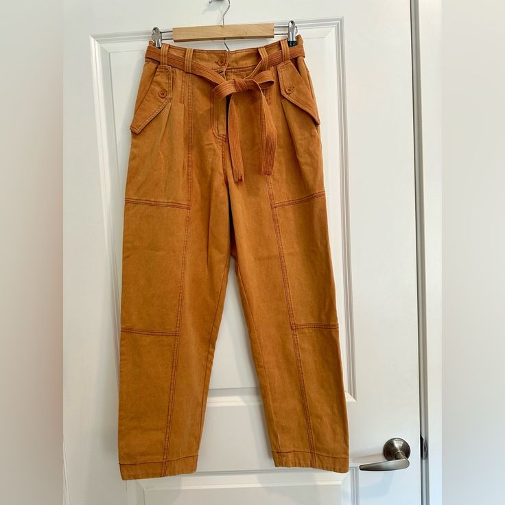 Soft Orange Denim Trouser With Removable Belt And Deep Pockets. Comes With An Extra Button. Spring Utility Jeans With Belt Loops, High Rise Cotton Bottoms With Belt, High Rise Belted Cotton Bottoms, Belted High-rise Cotton Bottoms, High-rise Belted Cotton Bottoms, Brown Denim Workwear Pants, Brown Utility Jeans With Belt Loops, Brown Denim Pants For Workwear, Spring Brown Jeans With Belt Loops