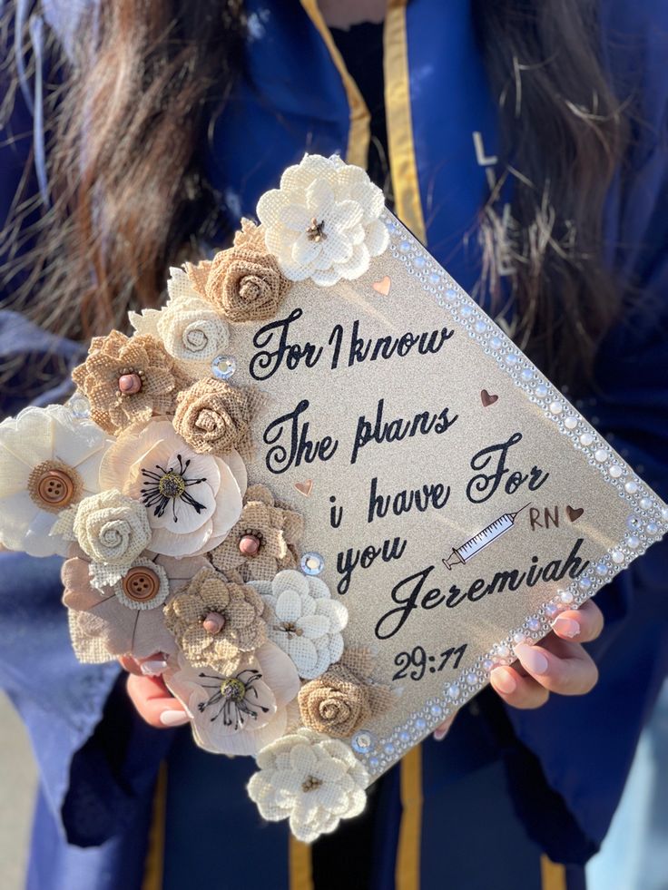 a woman holding a graduation cap with flowers on it and the words for i know she plans to have for you