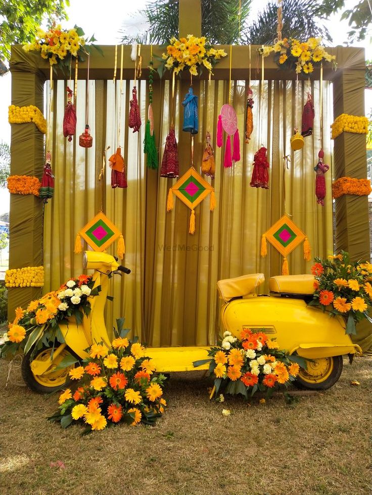 a scooter decorated with flowers and decorations for a wedding or other special event