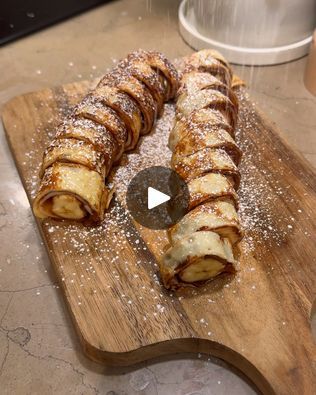 a wooden cutting board topped with lots of food