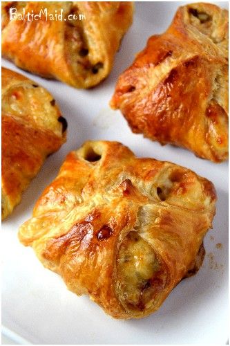 several pieces of pastry on a white plate