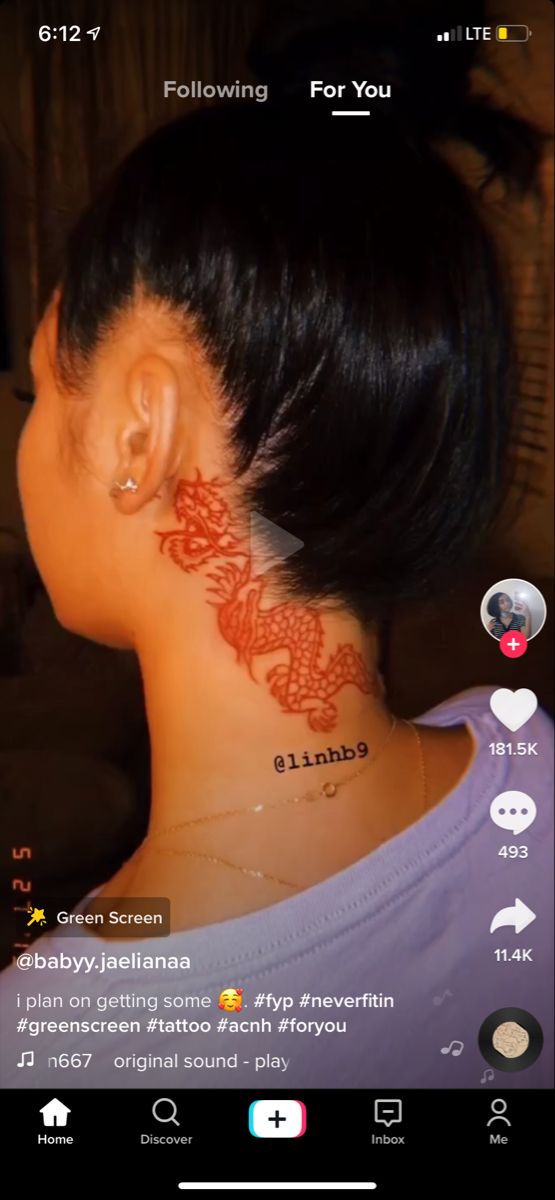 a woman with a tattoo on her neck