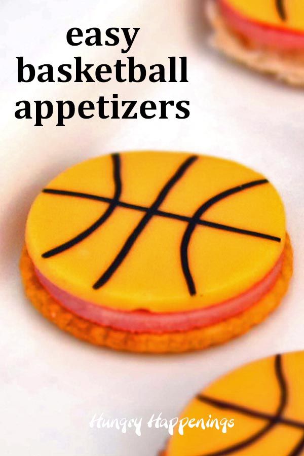 cookies decorated to look like basketballs with the words easy basketball appetizers on them