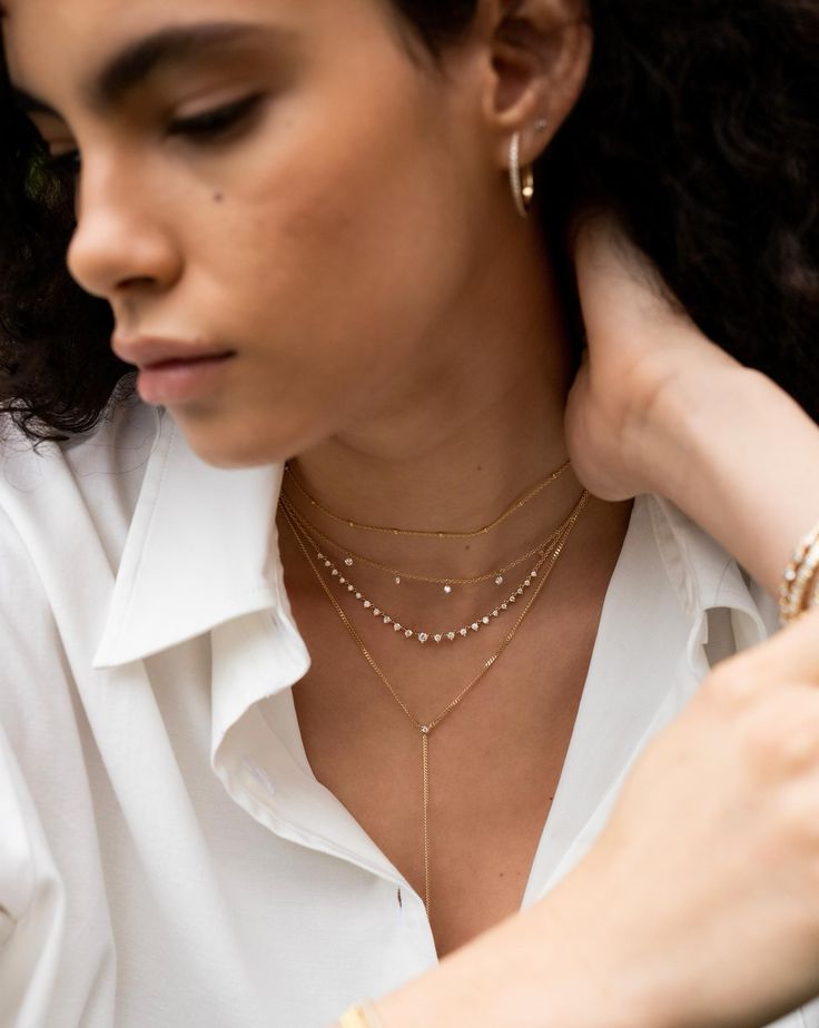 Why We Love It: With this best-selling style, five round-cut diamonds, strung along a delicate gold chain, appear to float against your décolletage. Layered Necklaces Outfit, Floating Diamond Necklace, Stackable Necklaces, Delicate Gold Chain, Ring Concierge, Necklace Length Guide, Necklace Stack, Necklace Outfit, Bracelet Size Chart