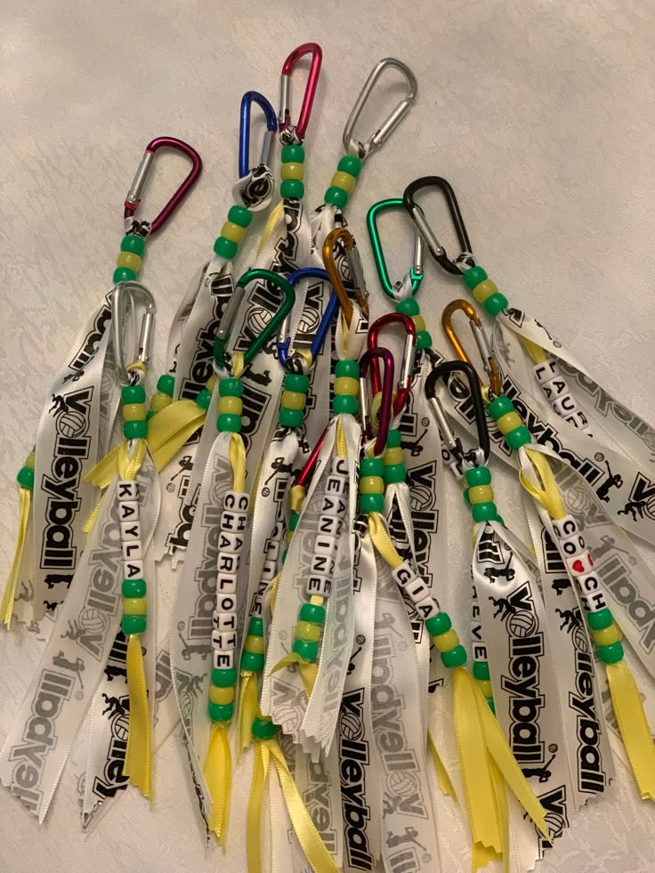 a bunch of lanyards that are laying on the ground together with some tags attached to them