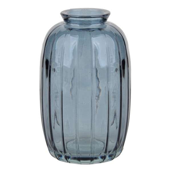 a blue glass vase sitting on top of a white table