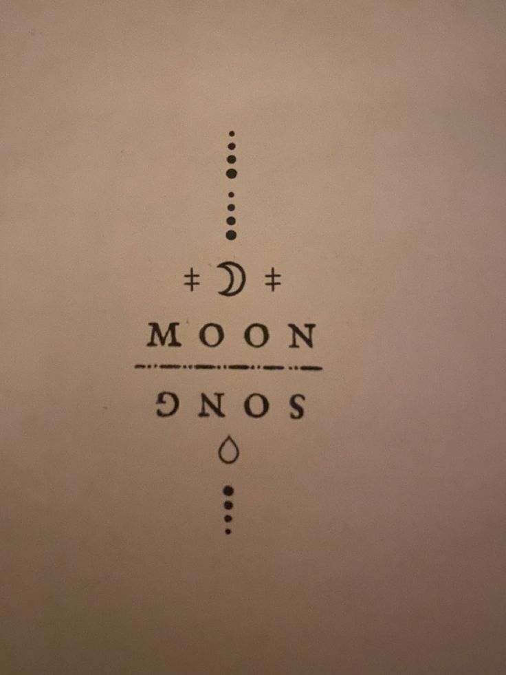 an upside down sign with the moon and noos written in black on white paper