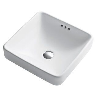 a white bathroom sink sitting on top of a counter