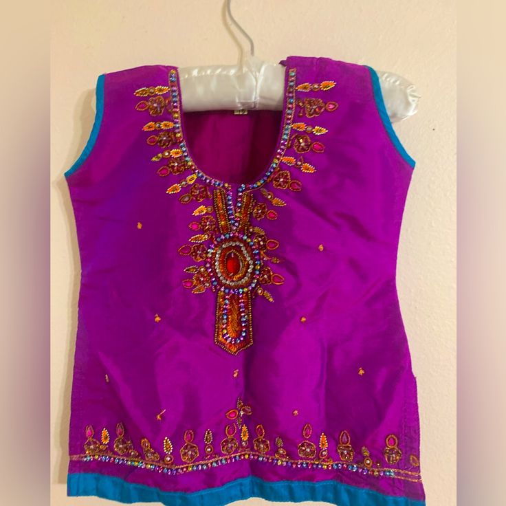 Pakistani/ Indian Style Sleeveless Purple Kurti With Blue Outline And Gorgeous Gems And Stones. Condition Is New, Never Used, Without Tag. For 1.5 Year Old Girls Kids. Purple Sleeveless Festive Sets, Purple Sleeveless Sets For Summer, Blue Sleeveless Top For Festive Occasions, Sleeveless Blue Top For Festive Occasions, Purple Cotton Sleeveless Vest, Blue Sleeveless Festive Top, Purple Sleeveless Cotton Vest, Purple Kurti, Sleeveless Kurti