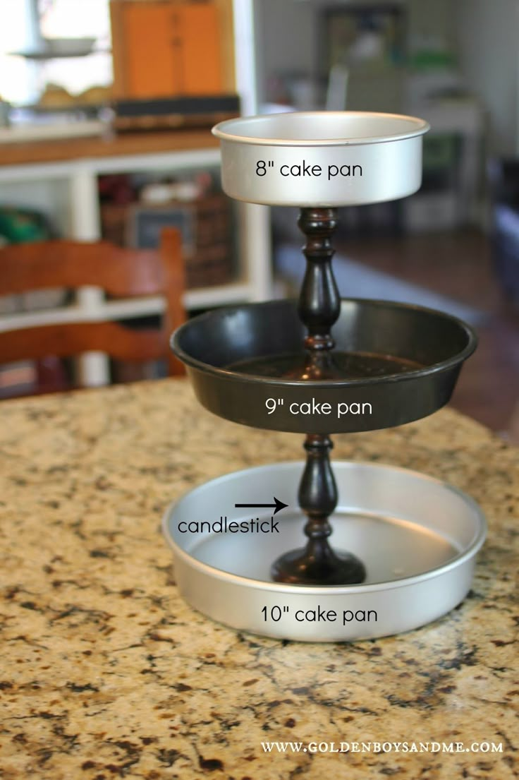 three cake pans stacked on top of each other in the middle of a kitchen counter