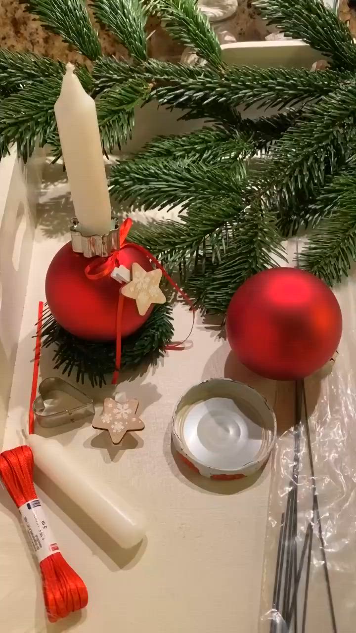 This may contain: christmas decorations on a table with candles and other items