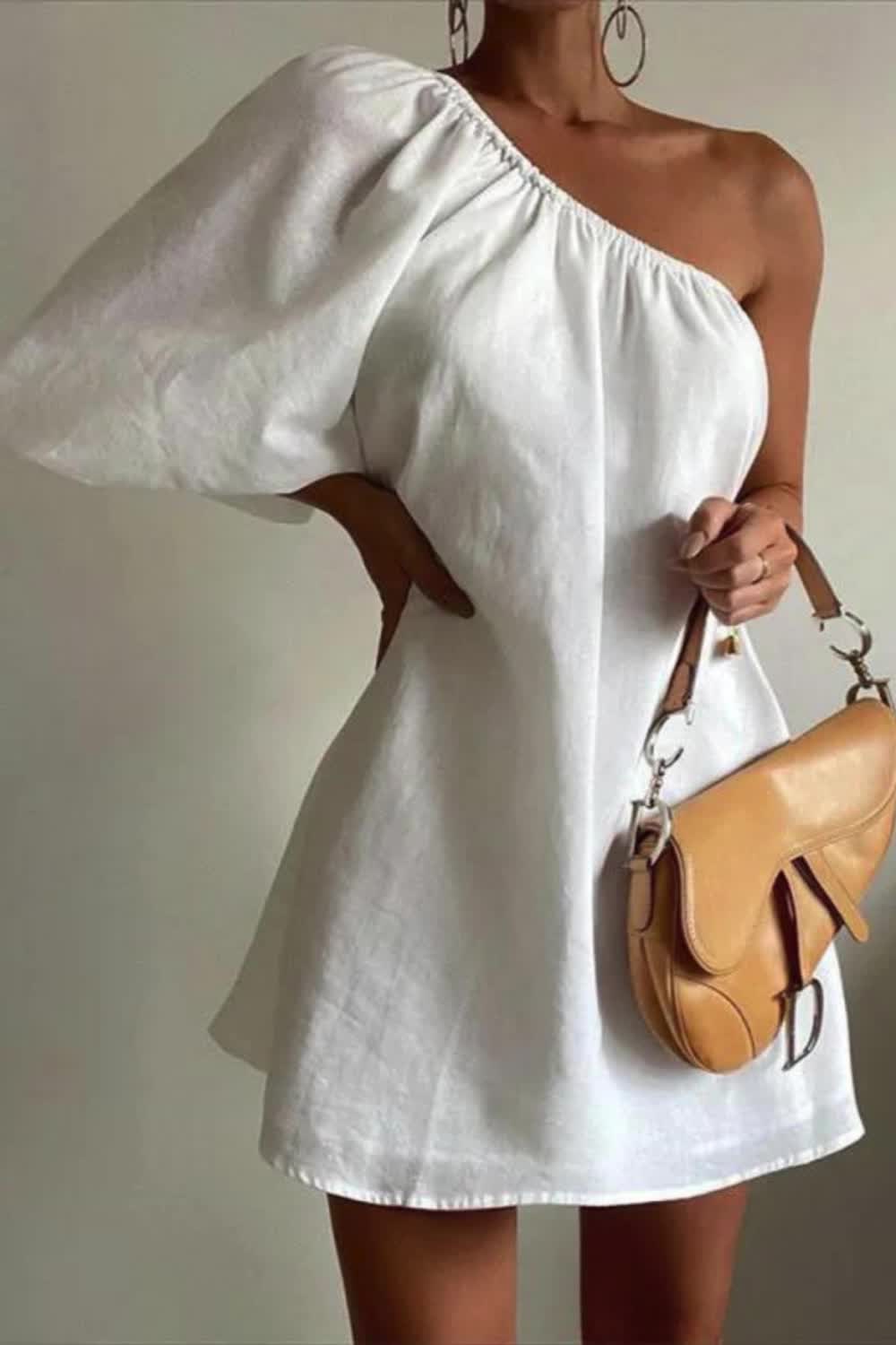 "Embrace effortless style with our Women's Solid Color Fashionable Loose Shoulder Dress. This relaxed, chic dress offers a comfortable fit and elegant look for any occasion."