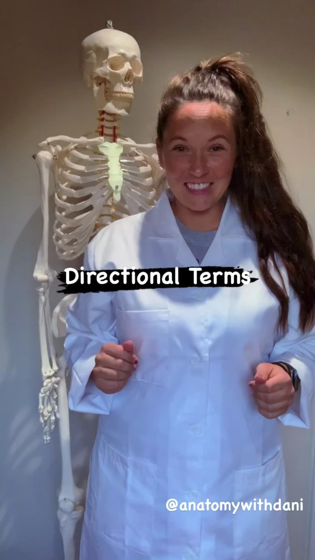 This may contain: a woman standing in front of a skeleton with the words directional terms on it