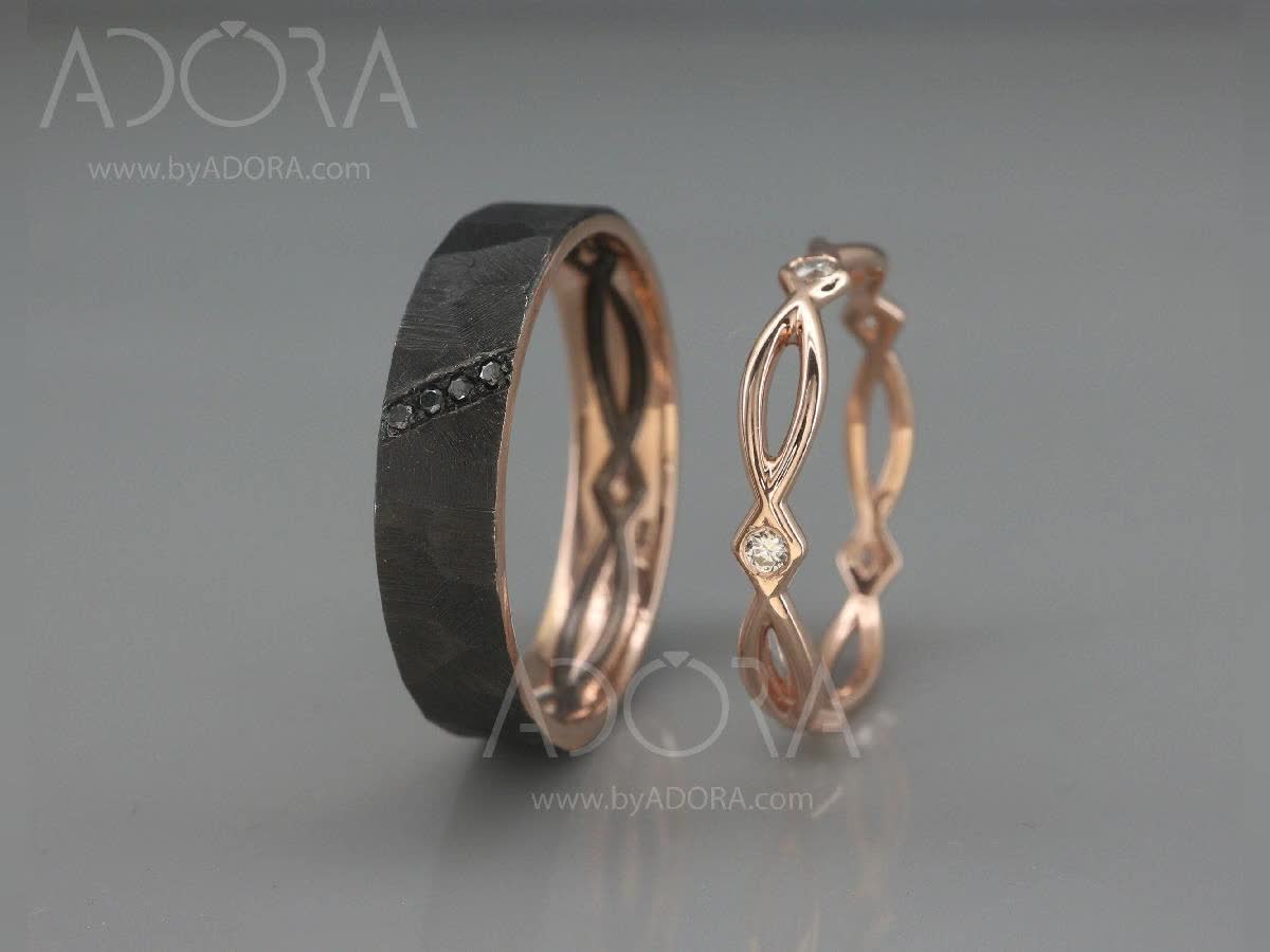 This may contain: two wedding rings with diamond accents on the inside and outside, set in 18k rose gold