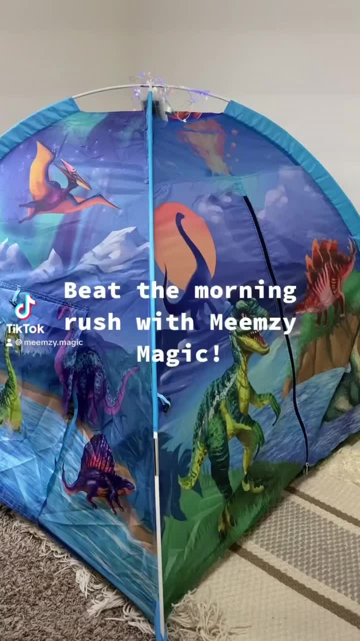 This may contain: there is a blue tent with dinosaurs on it that says beat the morning rush with meemzy