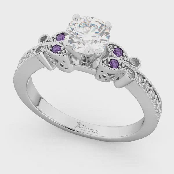 This may contain: a white gold engagement ring with purple and white diamonds