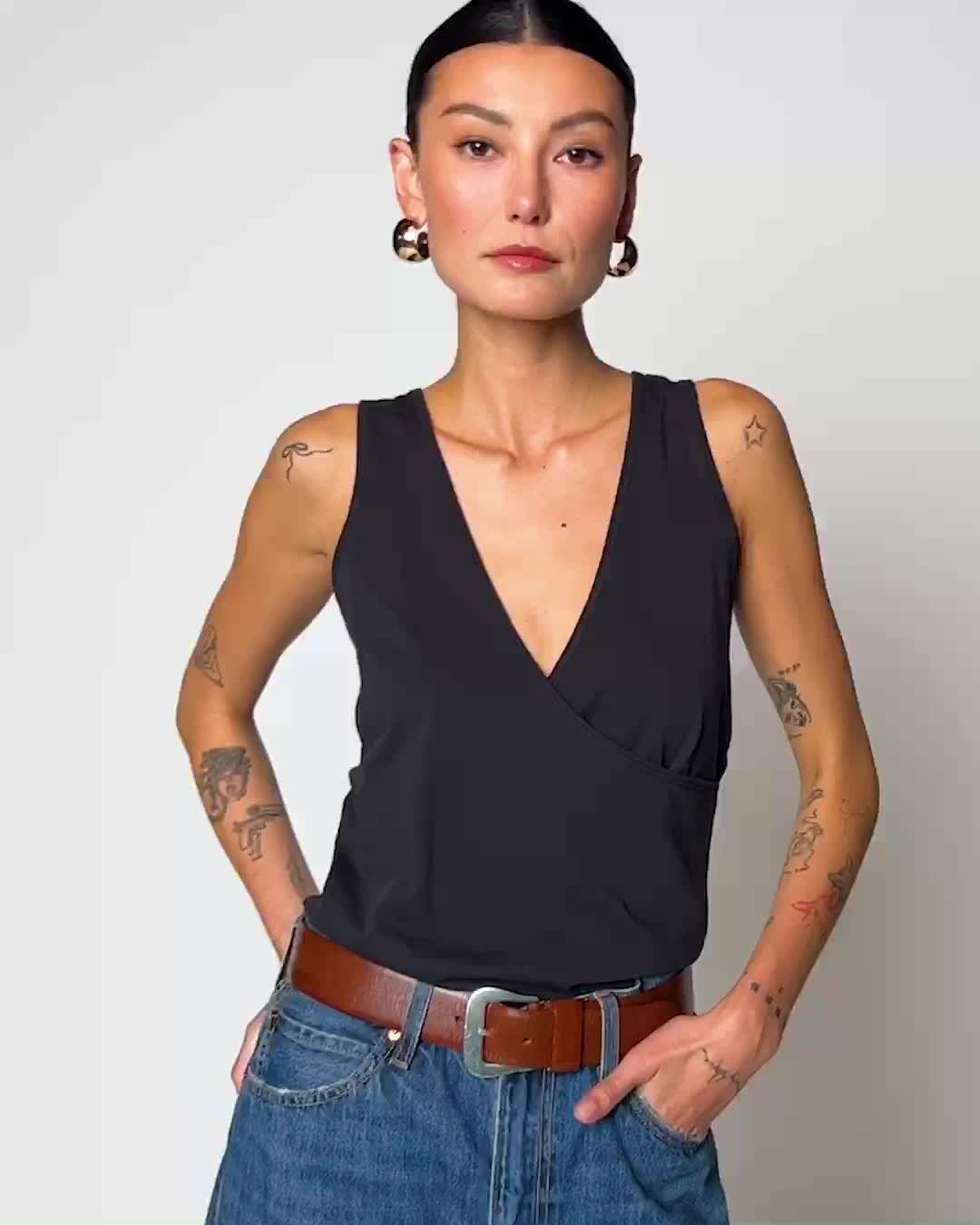 Because everyone needs a sleeveless wrap tank in their summer rotation. Pair it with your favorite denim cutoffs on off-duty days for an elevated casual look. (This one comes in Jet Black.) | Women's Jane Tank Top in Jet Black | Ethical Essentials