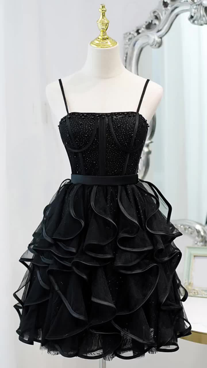 This contains: Special Black Ruffled Short Homecoming Dress with Spaghetti Straps