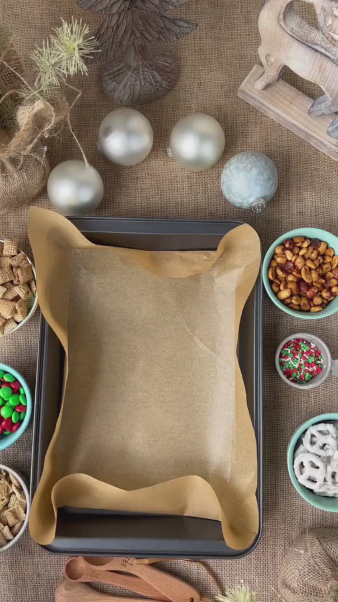 This may contain: a tray filled with cereal and pretzels on top of a table next to other items