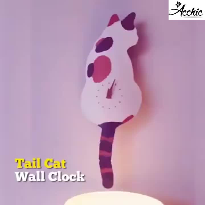 This may contain: a clock that is on the side of a wall with a cat standing on it's back legs