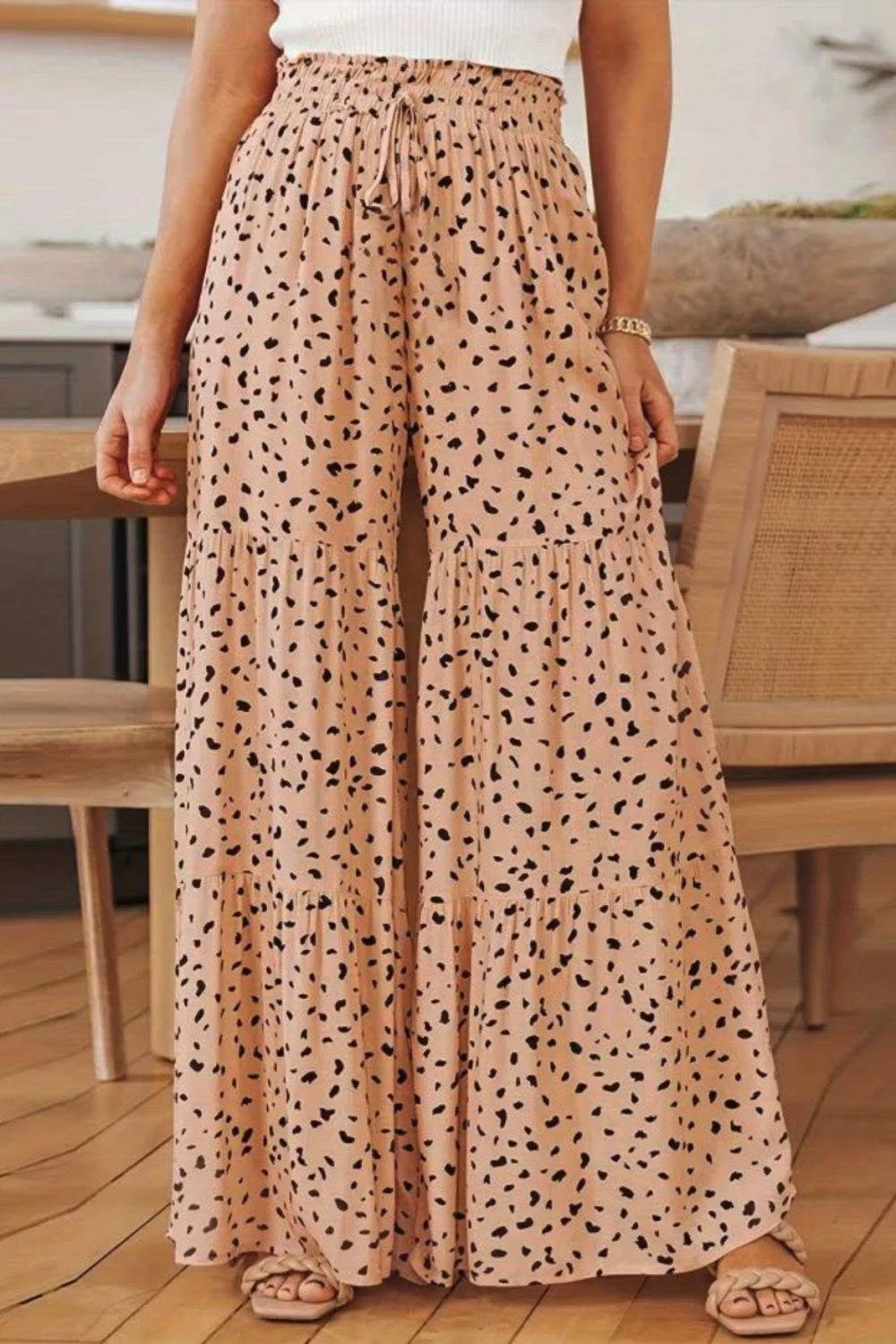 The Leopard Print Ruffle Hem Loose Wide Leg Pants are a chic and playful addition to your wardrobe. Featuring a trendy leopard print and ruffle hem detail, they exude a fun and stylish vibe. With their loose wide-leg silhouette, these pants offer both comfort and flair, making them perfect for adding a bold statement to your everyday look.